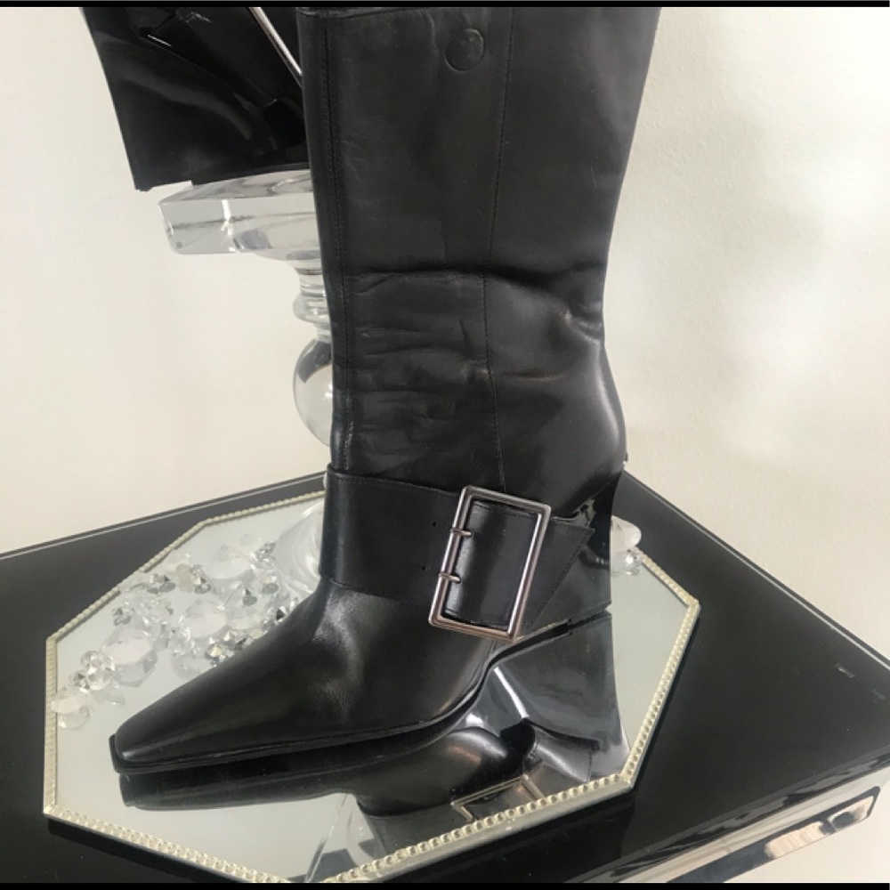 Black boots below the knee above the ankle